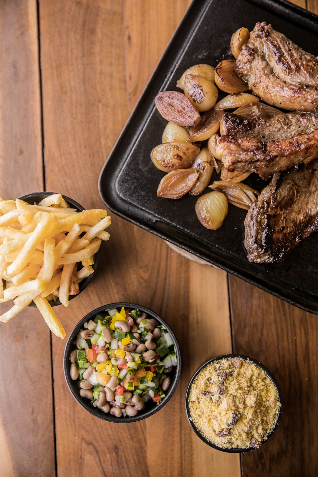 fries-and-fried-chicken-on-black-tray-d-ofpvxzwxu